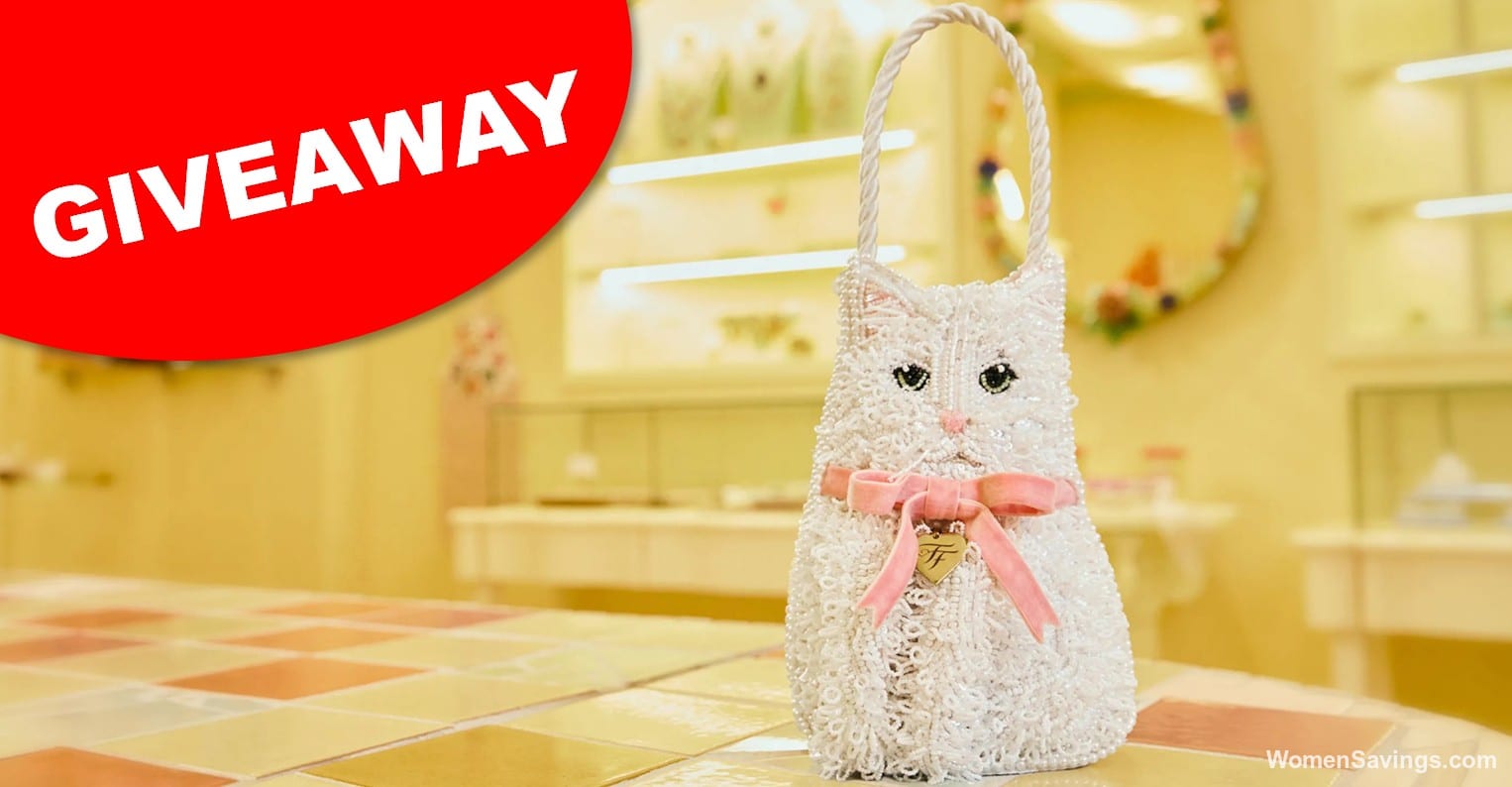 Susan Alexandra Little Gem Micro Bag shaped like the Fancy Feast cat with white beading, pink ears and a pink satin bow