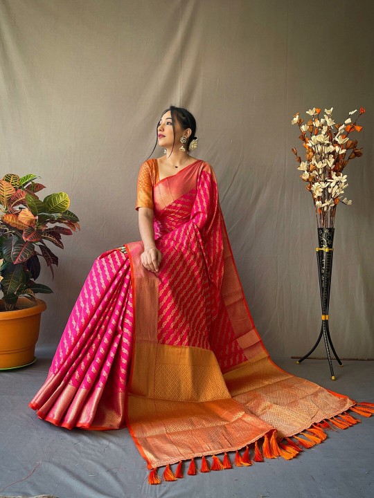 Pink and gold-toned patola saree