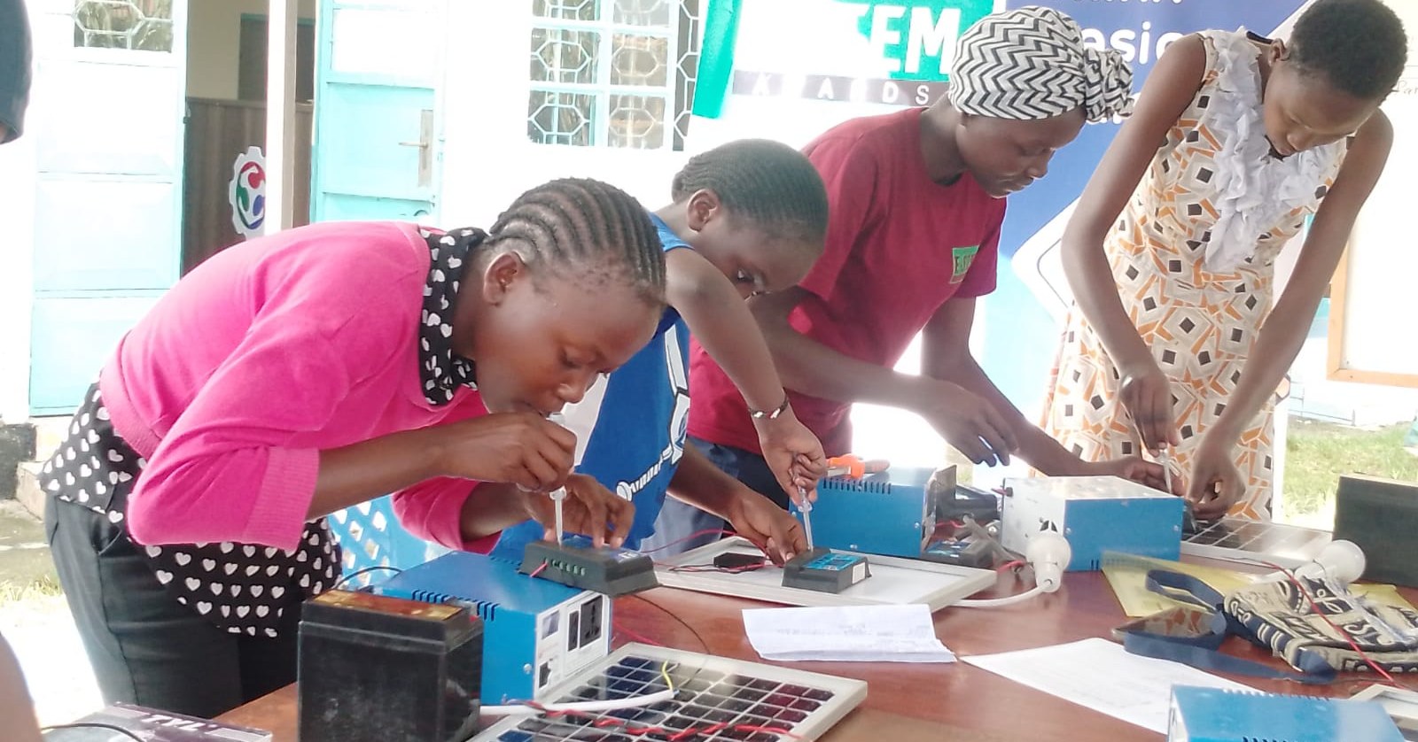Girls taking part in the ESTEM program with solar kits