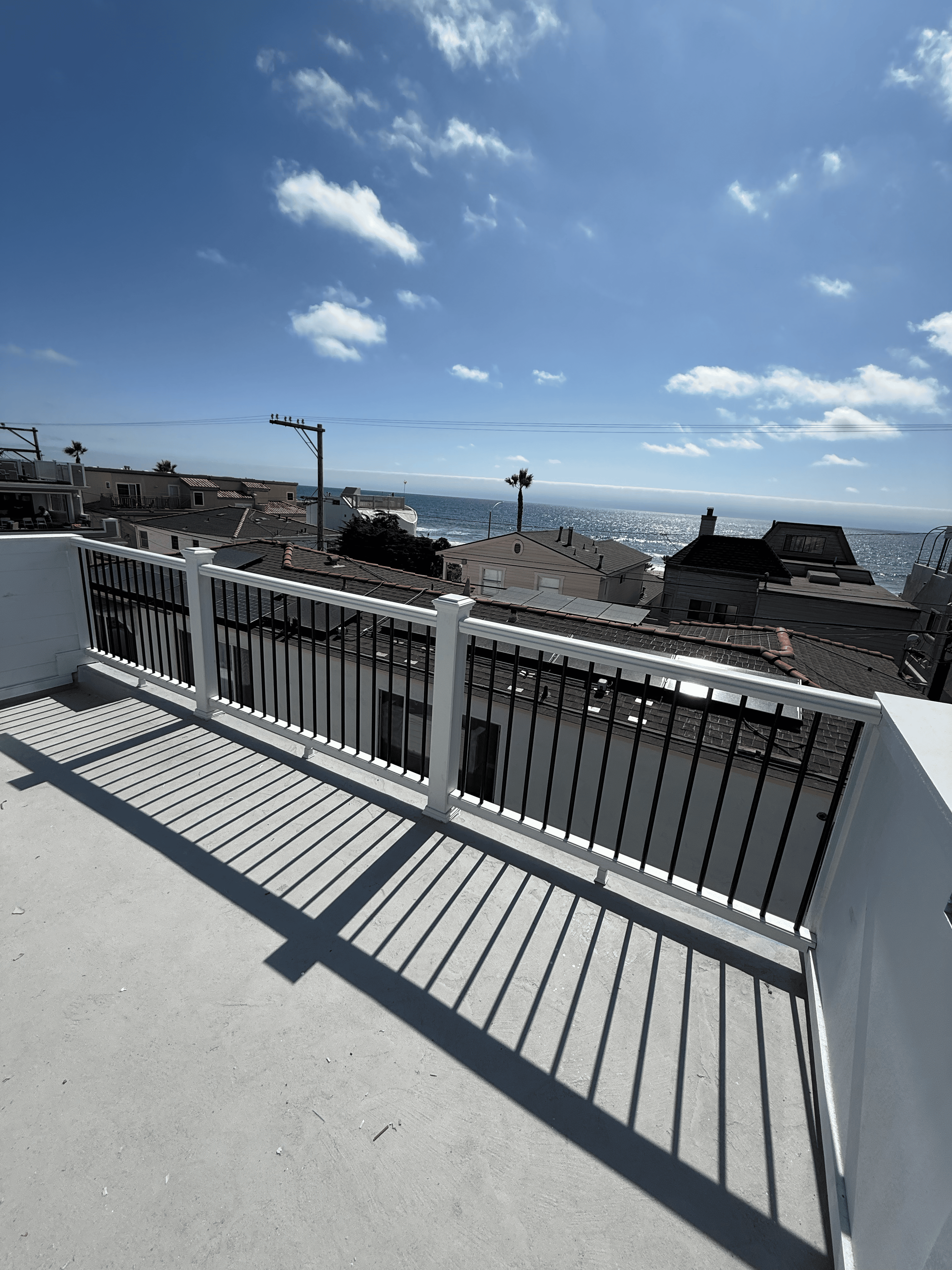 Rooftop deck railing with ocean view