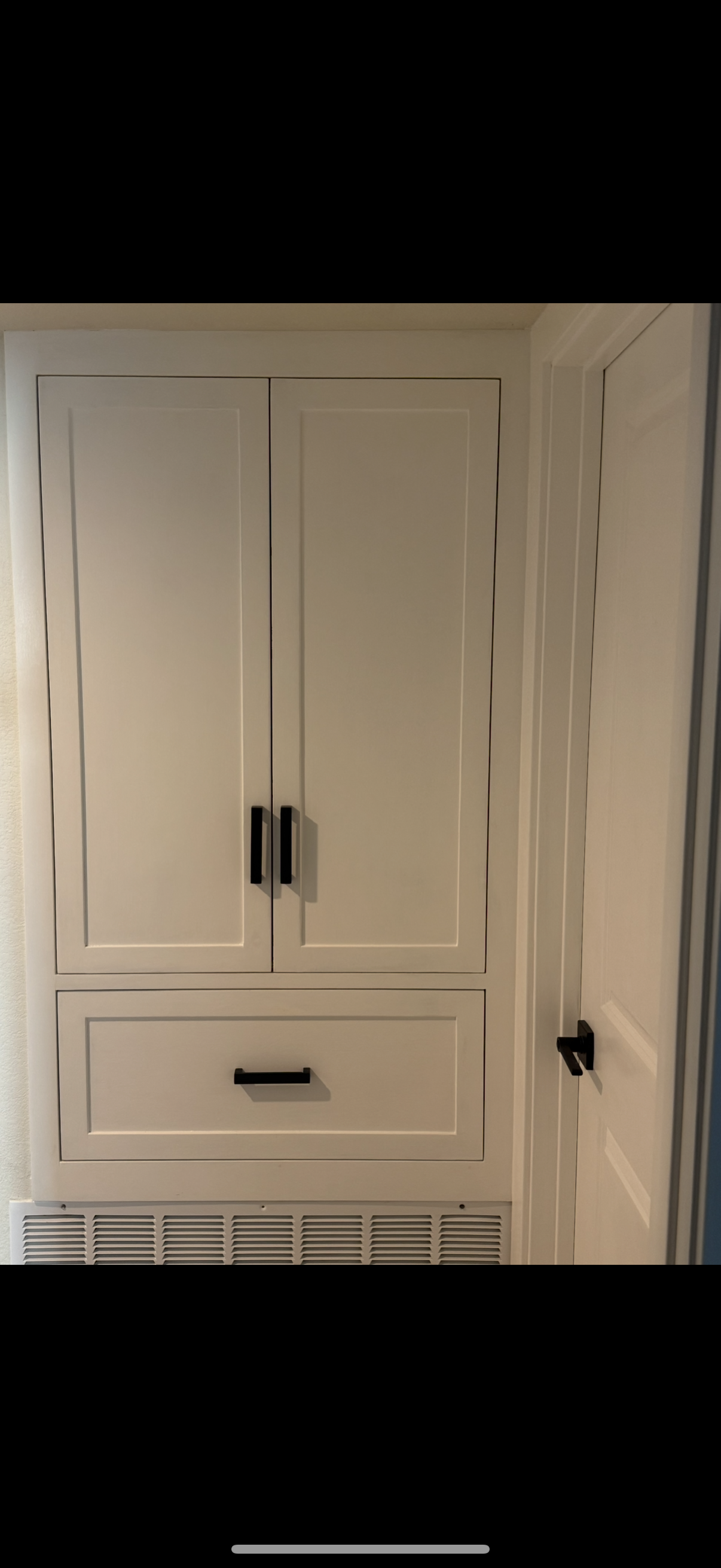 Built-in wardrobe with raised-panel shaker doors and drawer