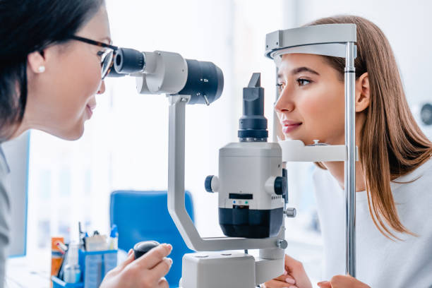 Side view of woman getting her eyes checked