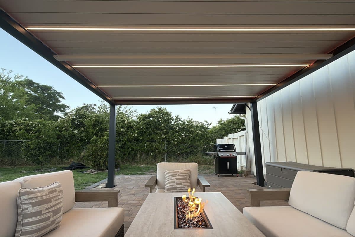 Atlas louvered patio cover in graphite finish with white louvers, installed in Ramona, California