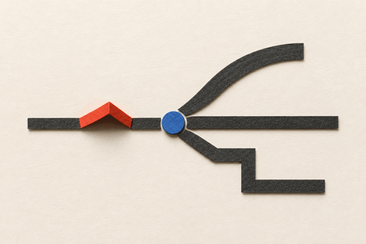 A small cobalt paper marker at a junction of three open paths, with a vermilion paper ridge behind it.