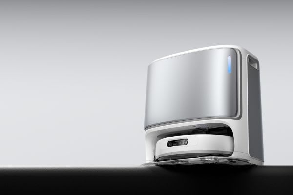 A sleek robot vacuum dock placed on a countertop, demonstrating how to hide robot vacuum devices elegantly in modern homes.