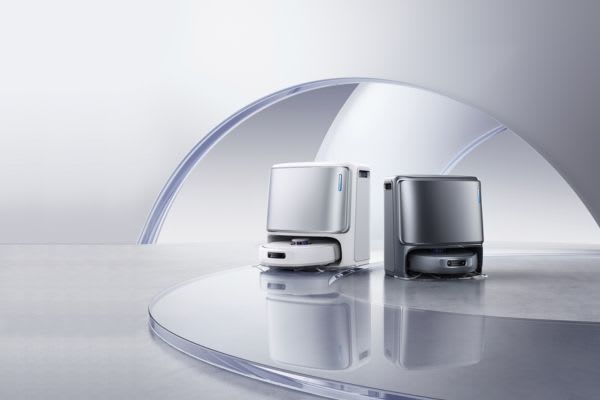 Two modern robot vacuums in a sleek, minimalistic setting, showcasing design and technology for cleaning solutions. Learn how to turn off robot vacuum for maintenance.
