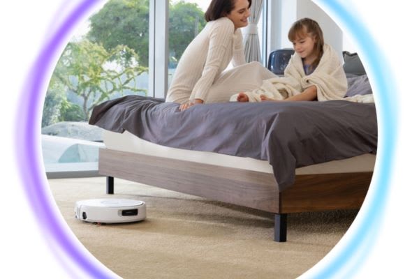 A mom and daughter enjoy time together while a robot vacuum operates quietly on a carpeted floor, showcasing its 5ghz connectivity.