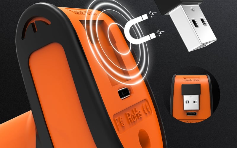 A close-up of barcode scanner hardware, showcasing its USB connection and magnetic charging feature in an orange design.