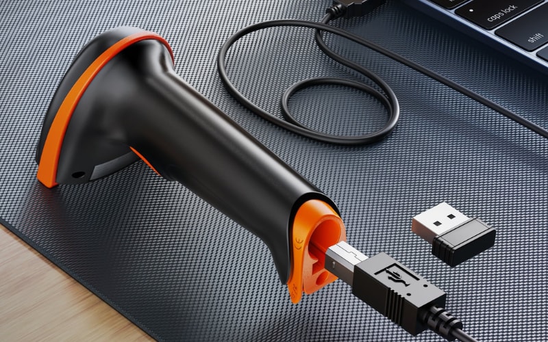 A close-up of a barcode scanner hardware with USB connectors, showcasing its design and connectivity features on a textured surface.