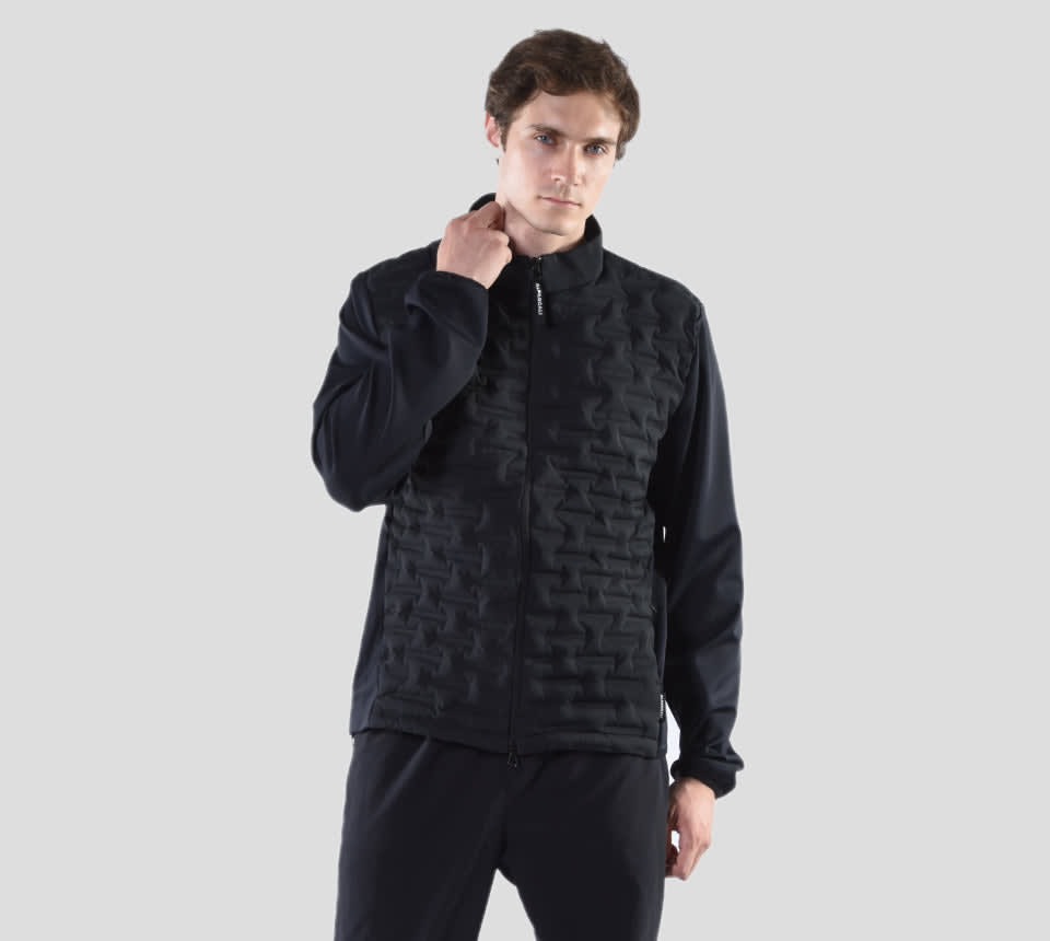 A model wearing a stylish jacket made from teflon coated fabric, showcasing a modern design and functionality.
