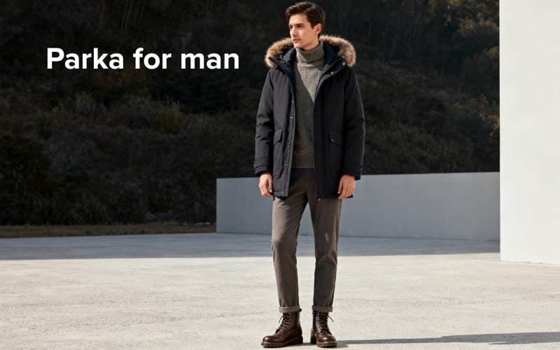 Stylishly dressed man in a parka for men, comparing the versatility of parka vs jacket for cold weather.