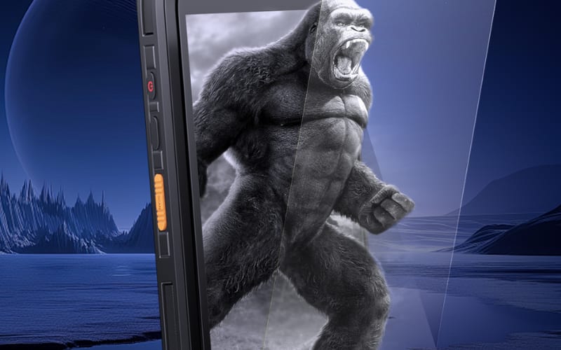 A rugged device showcasing an industrial barcode scanner design, set against a dramatic alien landscape with a gorilla figure.