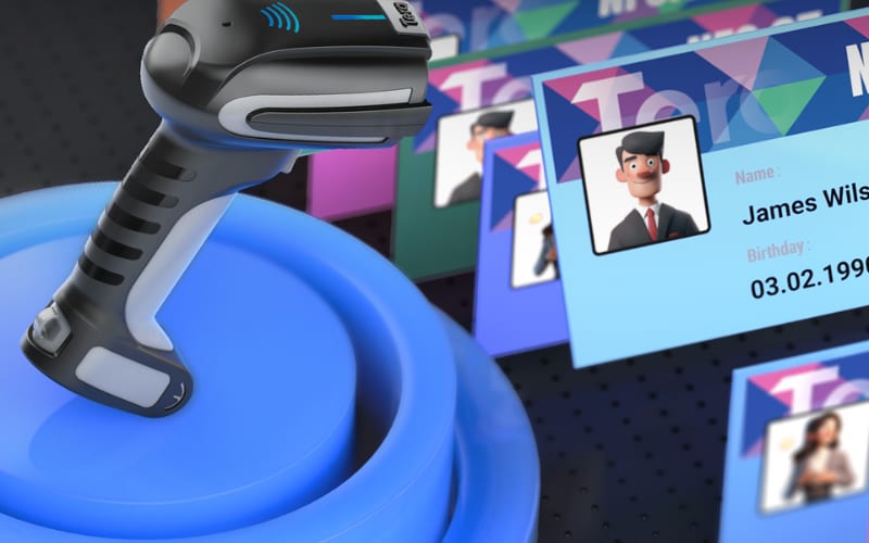 A delivery scanner resting on a blue platform, with colorful ID cards featuring names and birthdays in the background.