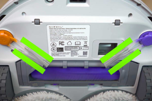 The underside of a dusting robot showcasing its cleaning components and user information label.