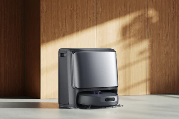 A sleek robotic vacuum in a modern interior, showcasing advanced features for a vacuum comparison.