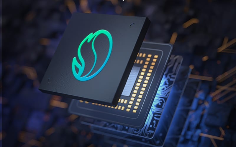 A close-up of a black microchip featuring a glowing logo, representing advanced technology for barcode scanner integration.