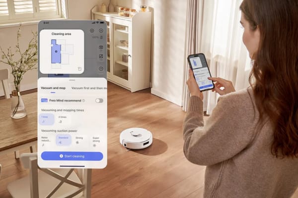A woman uses her smartphone to control a robot vacuum without wifi in a neatly arranged living room.