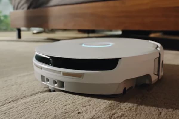 A sleek robot vacuum designed for efficient cleaning, featuring advanced 5GHz connectivity for seamless operation.