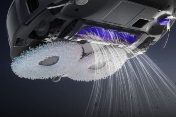 A close-up of a vacuum cleaner's brush and suction mechanism, illustrating how to measure vacuum suction.