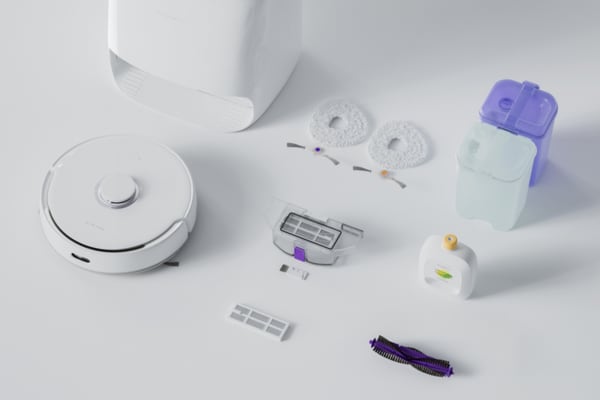 A vacuum cleaner with various parts and accessories, showcasing how to use a vacuum cleaner effectively.