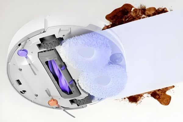 An illustrated view of a robot vacuum revealing its interior, showing cleaning pads and dirt. Discover robot vacuum hacks!