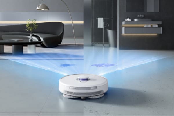 A modern robot vacuum navigates a stylish living space, showcasing tips on how to teach your robot vacuum to avoid obstacles.