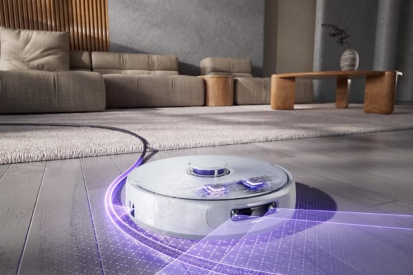 A robot vacuum navigating a stylish living room, demonstrating how to set up and use your robot vacuum’s app.