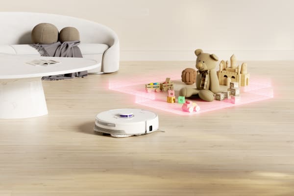 A robot vacuum navigates around a carpeted area with toys, showcasing tips for optimal performance on carpets.