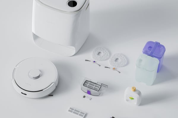 Robot vacuums and accessories are neatly arranged, showcasing tools for optimal carpet cleaning performance.