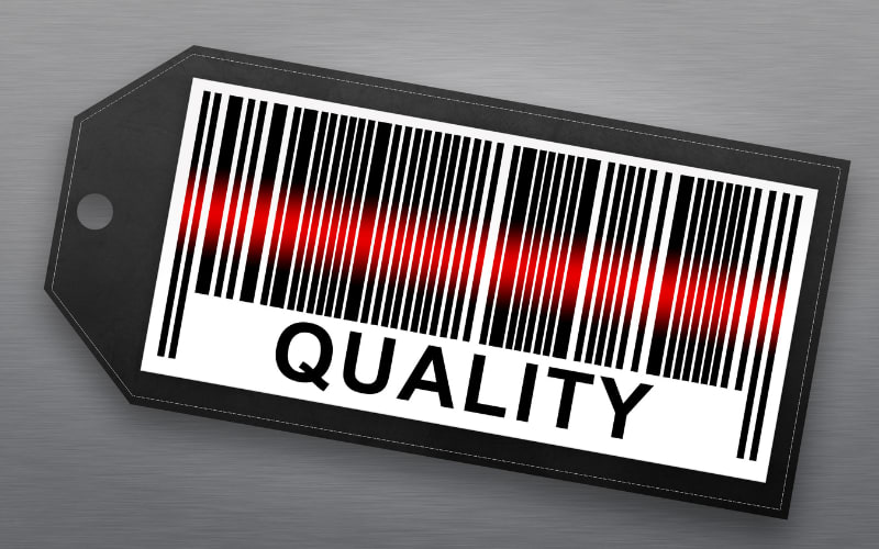 A tag featuring a barcode labeled "QUALITY," representing automatic identification and data capture technology.