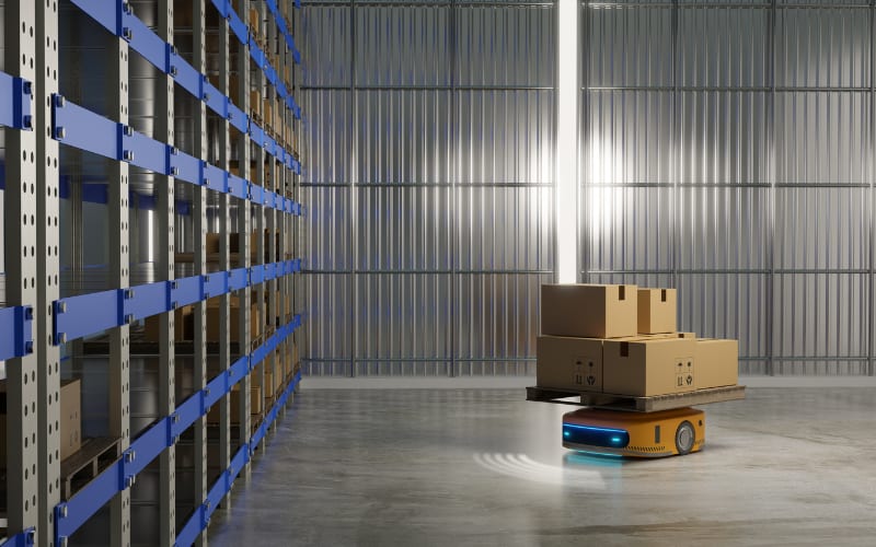 A robotic vehicle moves boxes in a warehouse environment, showcasing automatic identification and data capture technology.