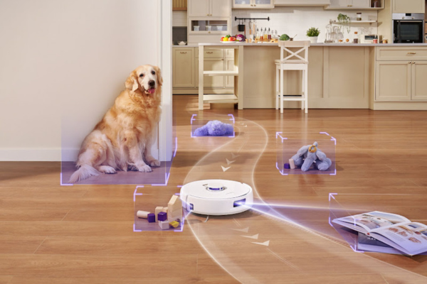 A robot vacuum navigates a stylish kitchen, avoiding obstacles like a dog and toys, showcasing how to troubleshoot your robot vacuum’s navigation issues.