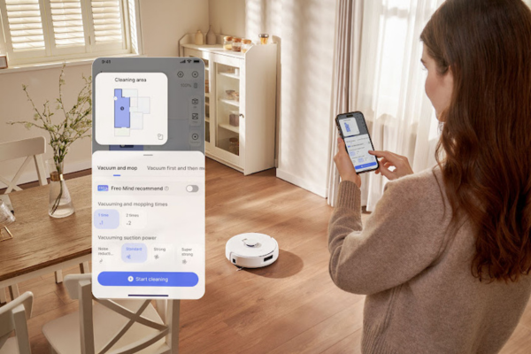 A woman uses her smartphone app to manage her robot vacuum's cleaning options and address navigation issues.