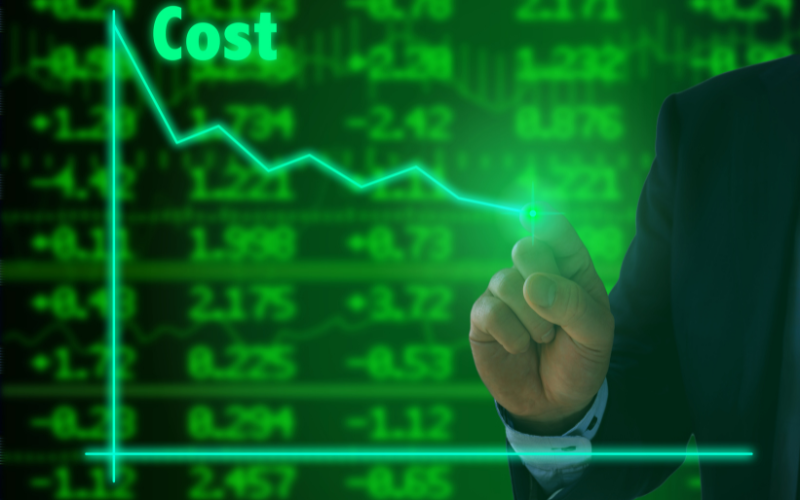 A hand tracing a declining graph with