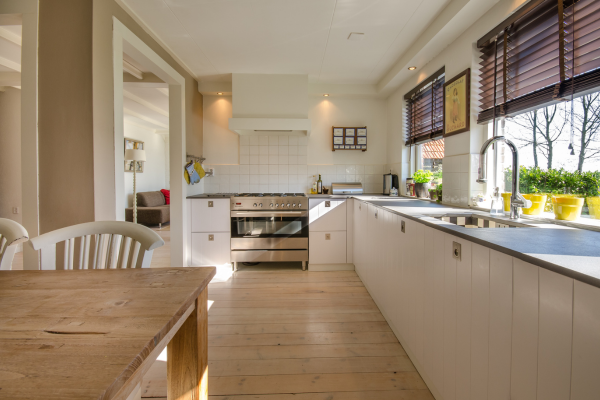 A bright and tidy kitchen, perfect for a spring clean up, featuring modern appliances and natural light.