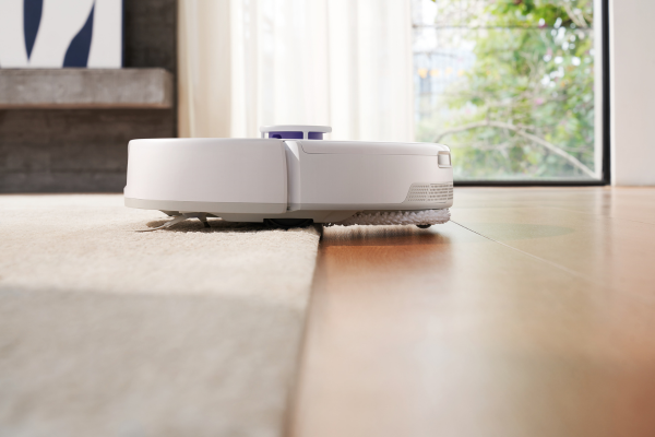 A robotic mop is seen on wooden flooring, demonstrating an efficient method of how to mop various surfaces easily.