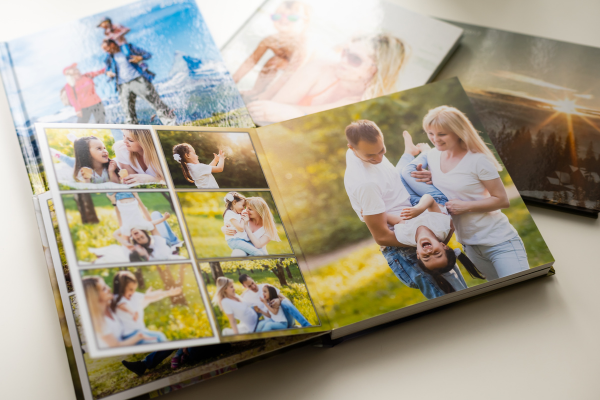 A collection of photo books showcasing joyful family moments, perfect ideas for Mother's Day gifts.