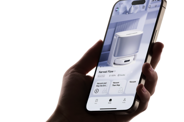 A hand holds a smartphone displaying a robot vacuum app, showcasing innovations in the future of robot vacuum technology.
