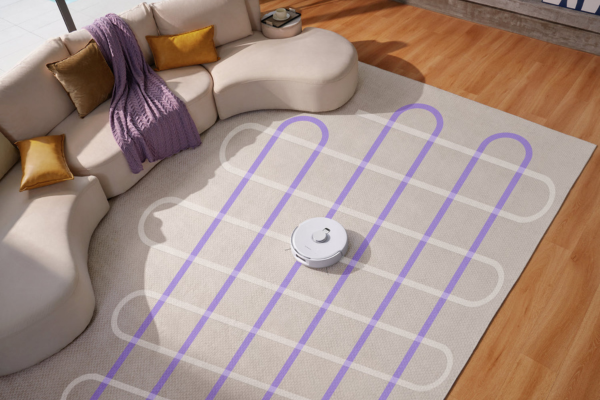 A modern room with a robot vacuum on a patterned rug, showcasing the best budget robot vacuum with mapping technology.