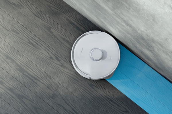 A sleek robot vacuum efficiently cleaning corners and edges on hardwood flooring, showcasing the best features for a thorough clean.