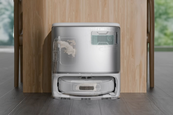 A modern best self emptying robot vacuum sits against a wooden wall, showcasing its sleek design and functional features.