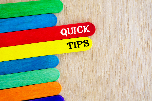 Colorful wooden sticks arranged with text “Quick Tips” to offer suggestions for cleaning after a party.