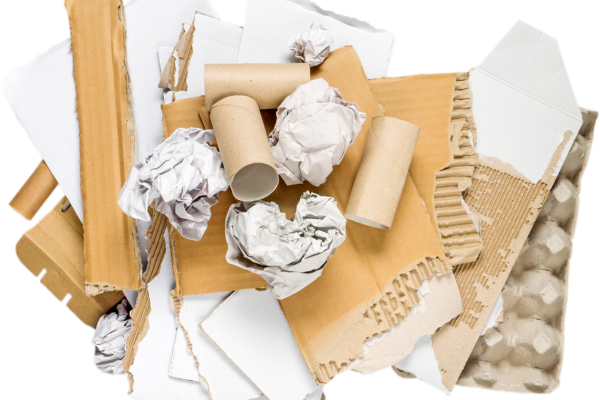 A pile of crumpled paper, cardboard, and empty rolls, showcasing the mess from cleaning after a party.