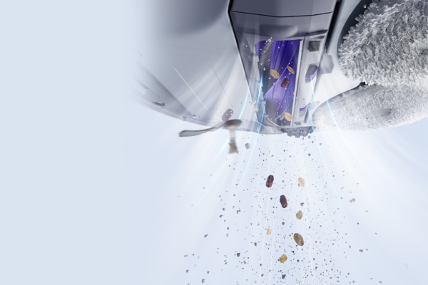 A powerful vacuum efficiently cleaning debris, ideal for maintaining concrete floors, showcasing the best vacuum for concrete floors.