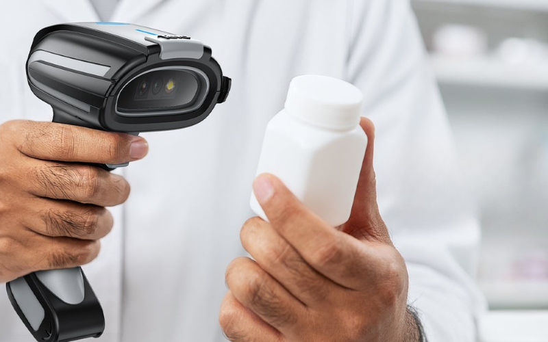 A pharmacist uses a barcode scanner to check medication, highlighting the importance of barcode scanner speed in pharmacy efficiency.