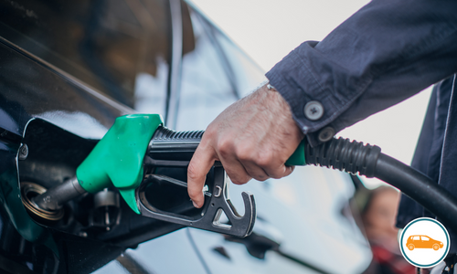 Person refuelling their car Person refuelling their car
