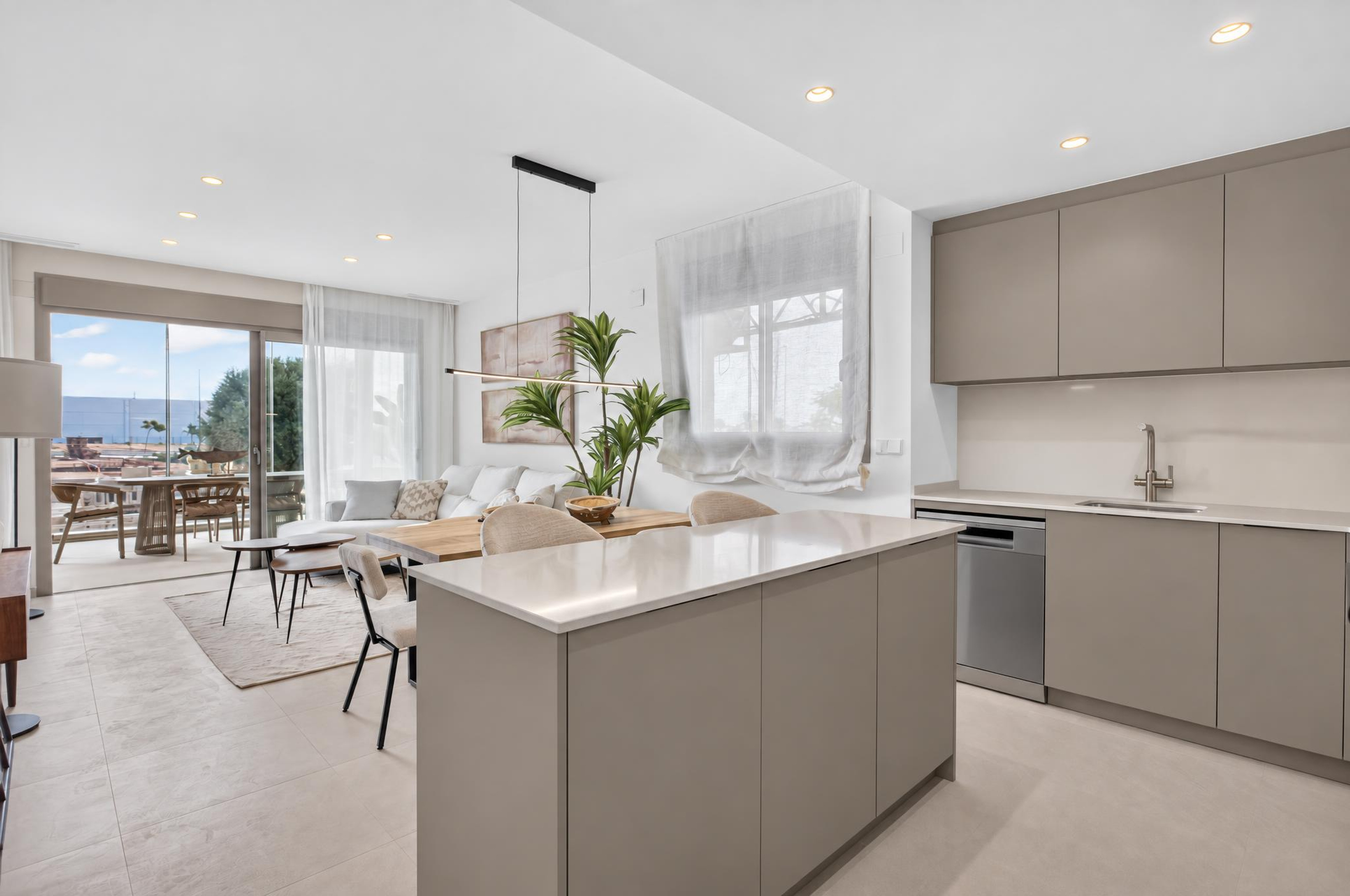 Open-plan living room and kitchen in a Sunset Village La Hoya new build apartment, Torrevieja