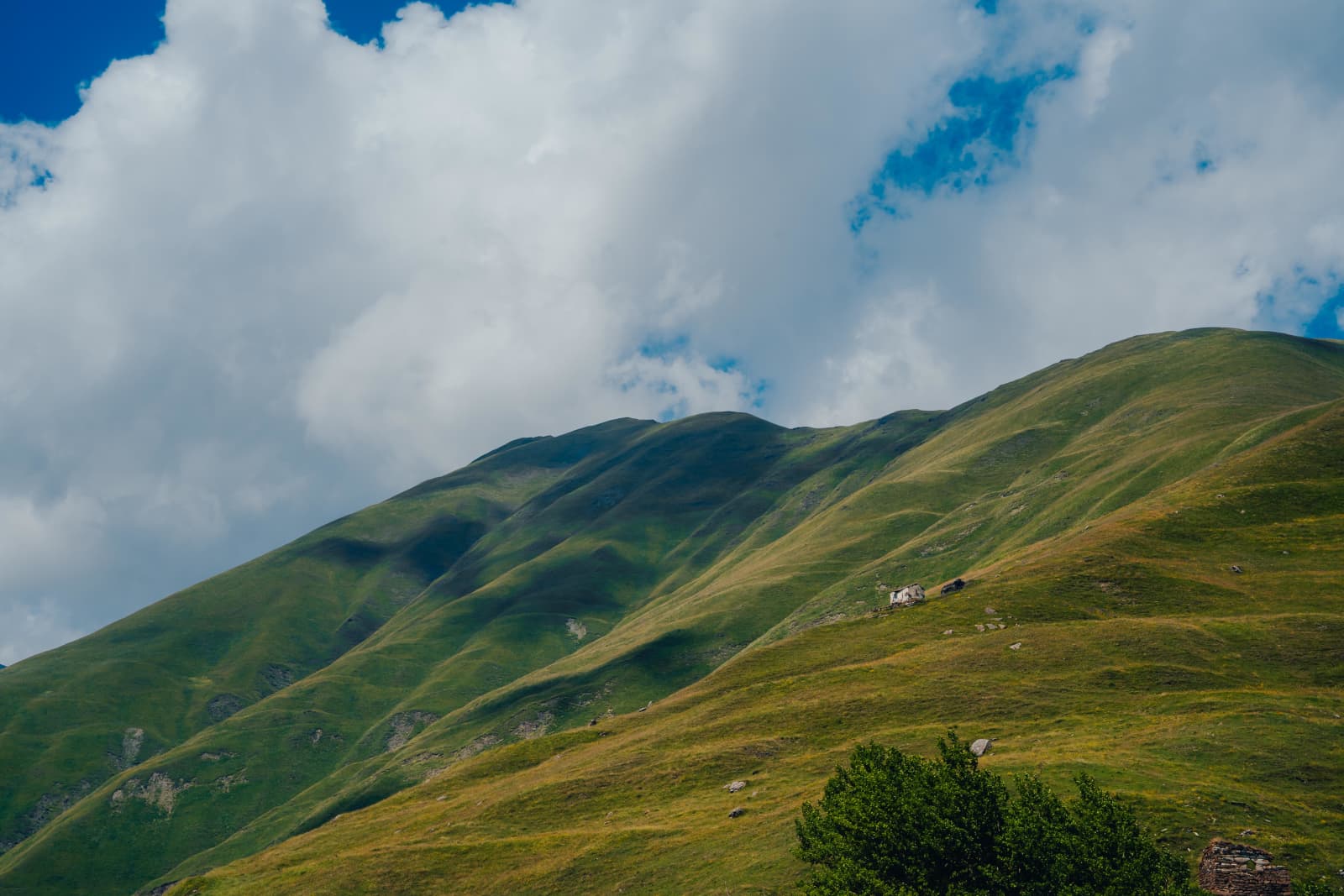 Velvet Green Slopes and Dramatic Sky