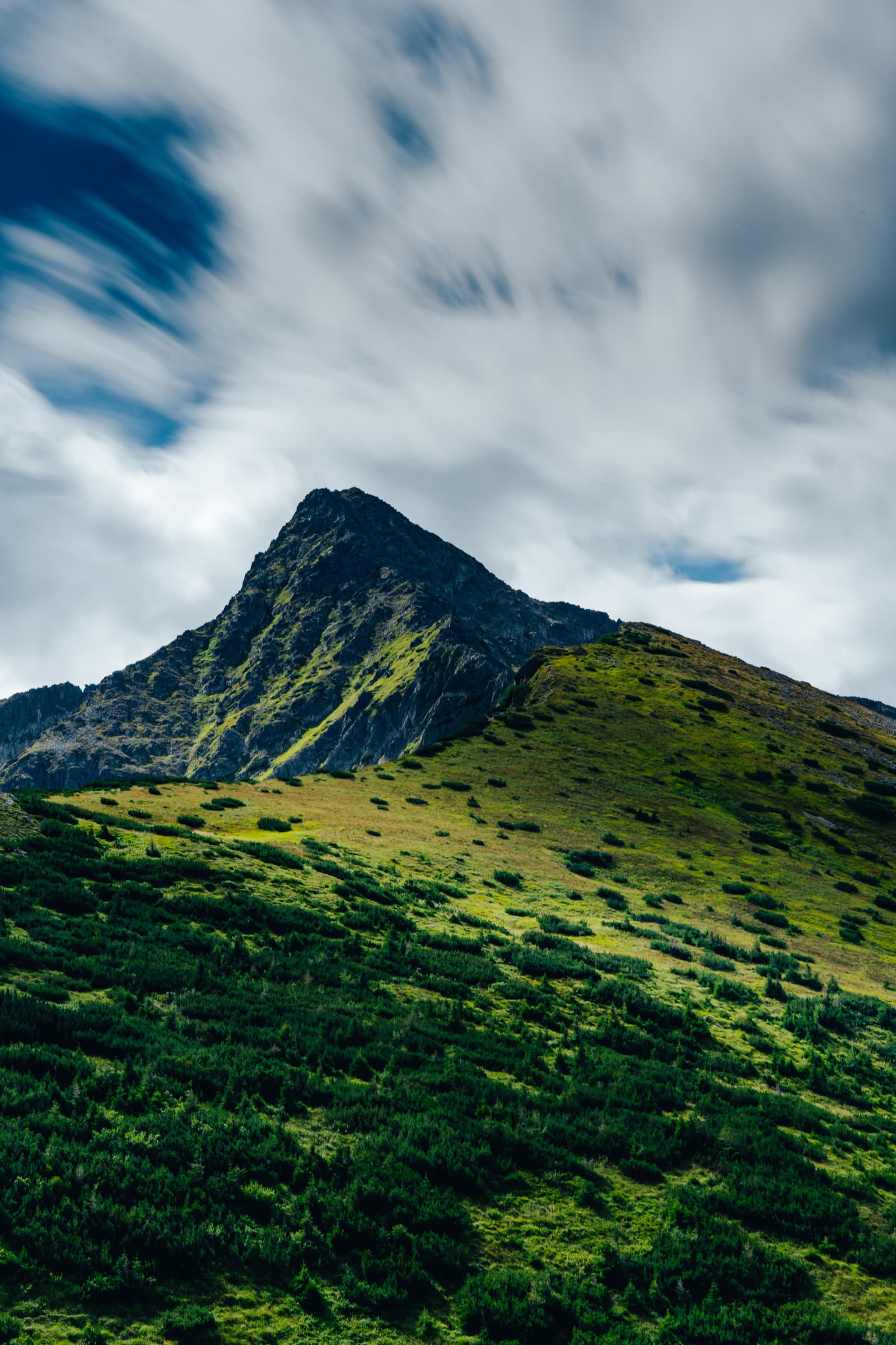 Clouds Streaming Over a Ridge