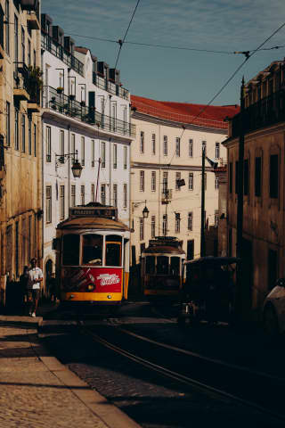Tram 28s Meeting in the Shadow of Lisbon's Streets